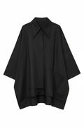 Black poncho on a white background