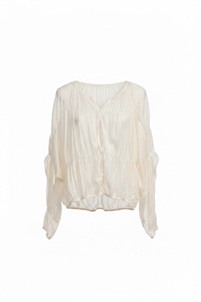 White blouse with ruffled sleeves on a white background