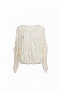 White blouse with ruffled sleeves on a white background
