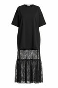 Black dress with lace overlay on a white background