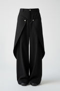 Black wide-leg pants with a draped front design on a white background