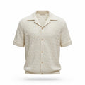 Beige patterned shirt with short sleeves on a white background